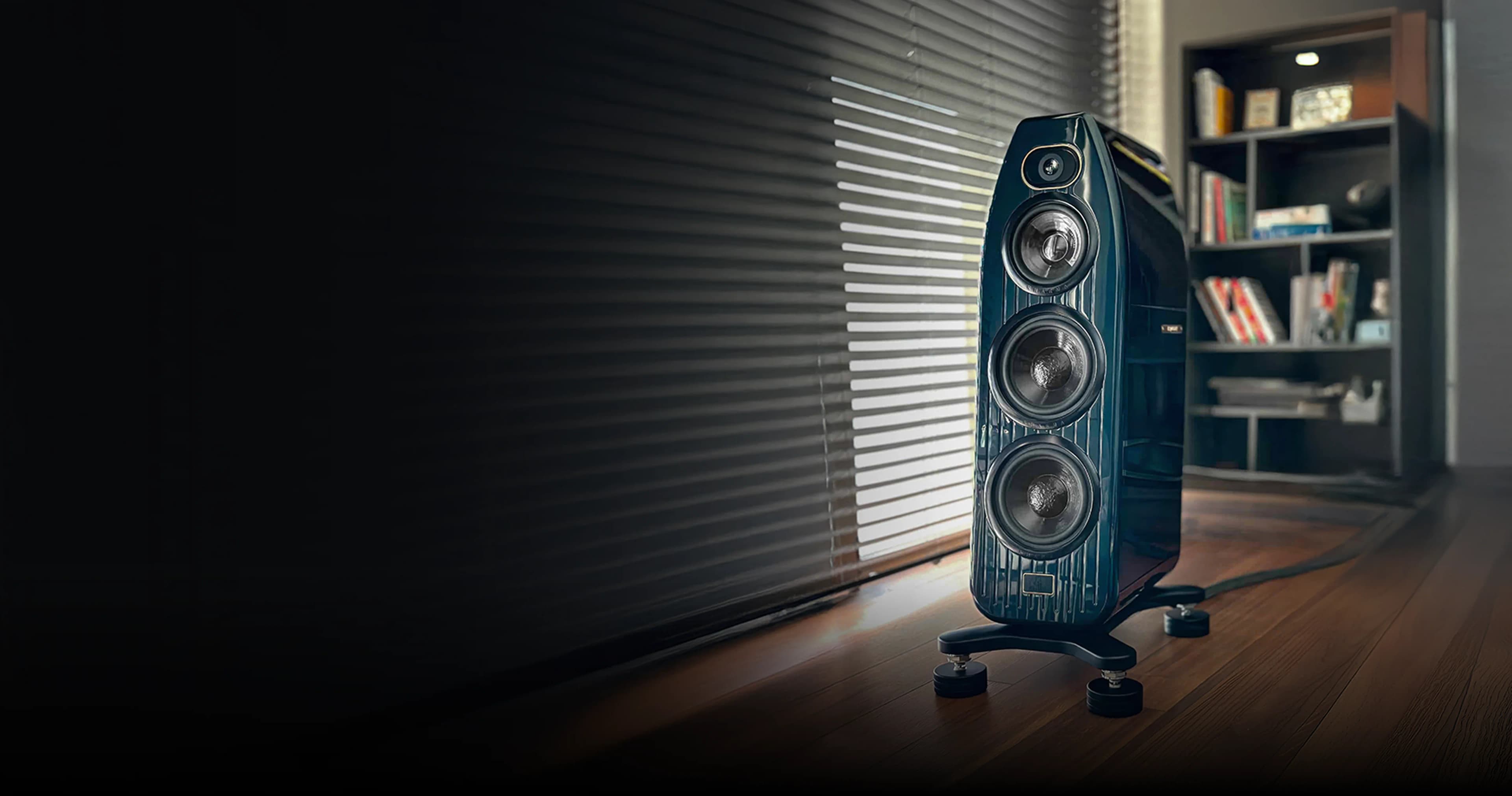Floorstanding loudspeaker on AUVA isolators in a listening room