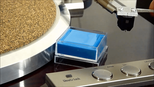 Stylus being lowered onto a gel stylus cleaner